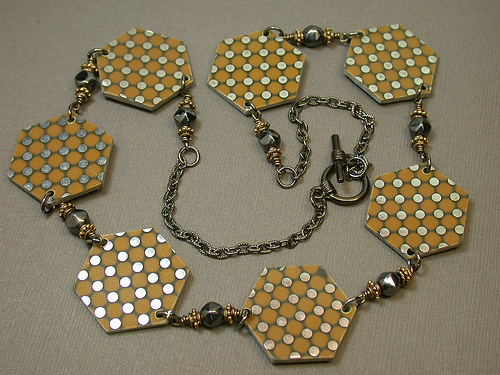 This necklace is one in a series from Debby Arem Designs. Titled "Three Ring Circuits" this necklaces using both recycled circuit boards and vintage beads